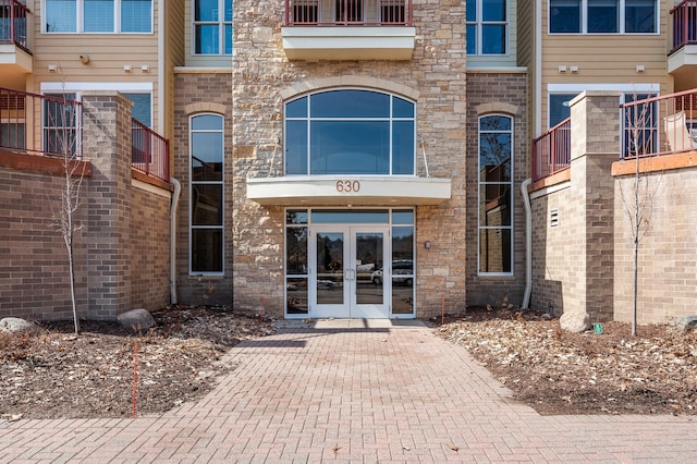 view of exterior entry featuring french doors