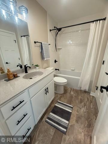 full bath with toilet, shower / tub combo with curtain, and vanity