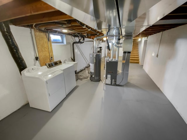 basement with gas water heater, stairway, heating unit, and washer and clothes dryer