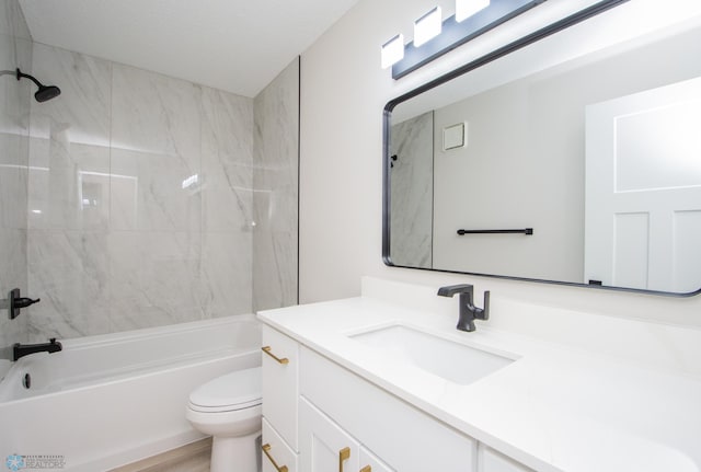 bathroom featuring shower / bathtub combination, toilet, wood finished floors, and vanity