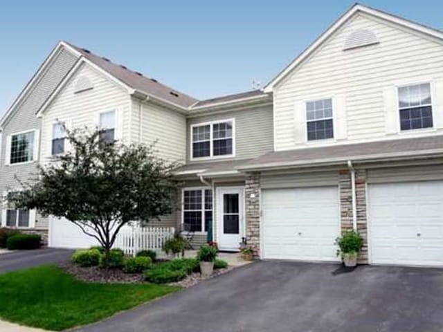 view of front of property featuring driveway and an attached garage