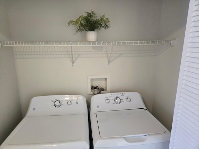 washroom with laundry area and washing machine and clothes dryer