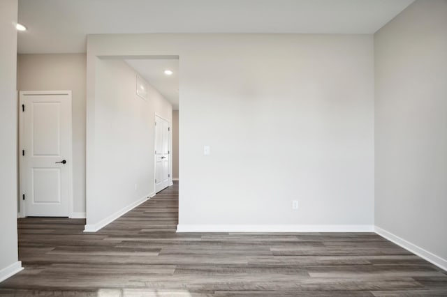 unfurnished room featuring recessed lighting, baseboards, and wood finished floors