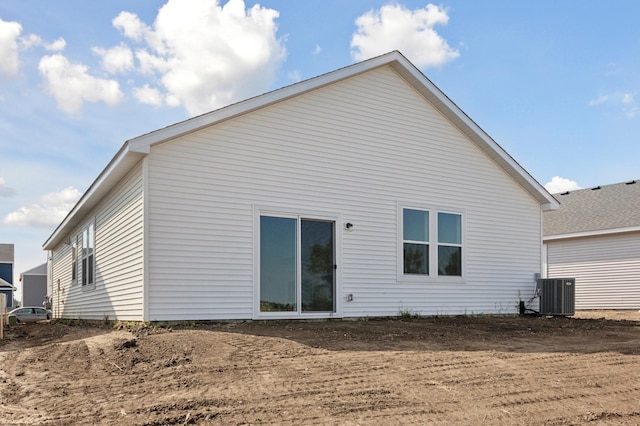 rear view of property featuring central AC