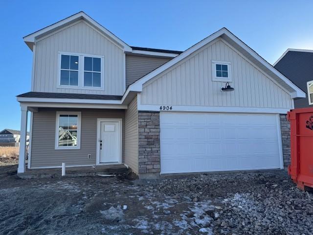 view of front of property with an attached garage and board and batten siding