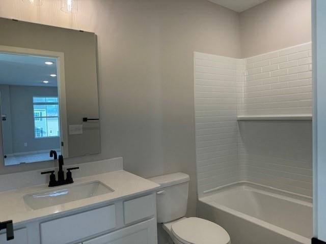 bathroom featuring toilet, shower / bathtub combination, and vanity