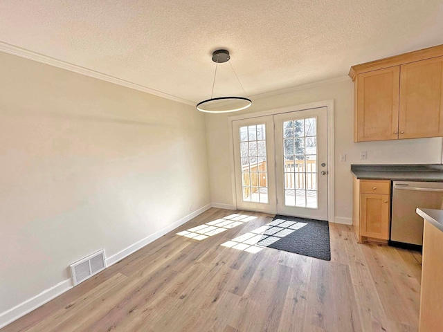 doorway with baseboards, visible vents, light wood-style flooring, ornamental molding, and a textured ceiling