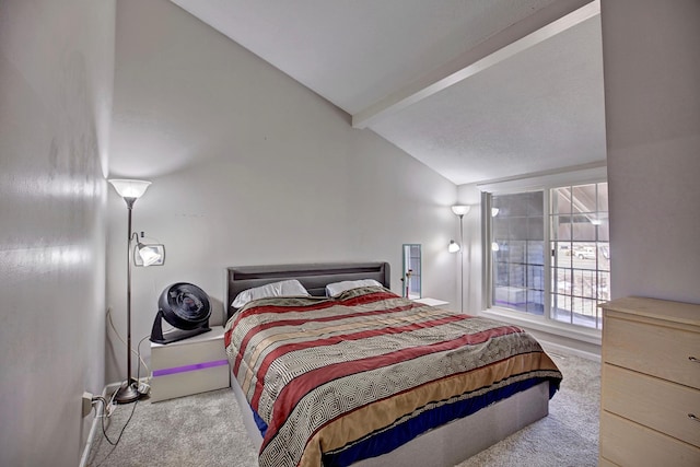 carpeted bedroom with vaulted ceiling with beams