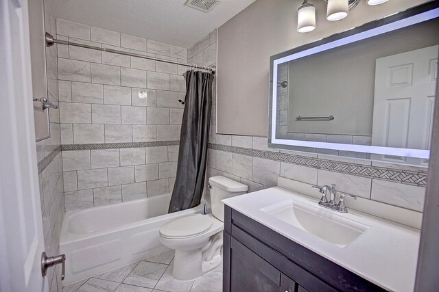 bathroom featuring vanity, visible vents, shower / bath combo with shower curtain, toilet, and marble finish floor