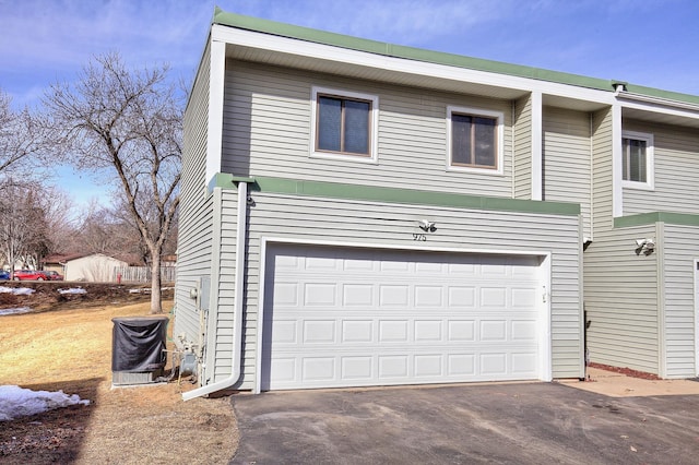 exterior space featuring driveway and a garage