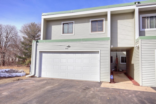 exterior space with driveway and a garage