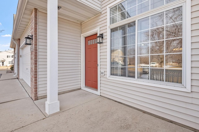 entrance to property featuring a garage