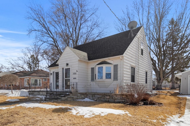 view of front facade with a shingled roof