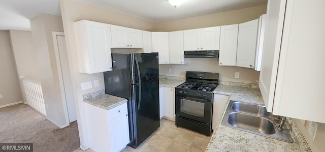 kitchen with a sink, black appliances, under cabinet range hood, a textured ceiling, and white cabinetry