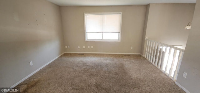 spare room with carpet flooring and baseboards