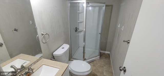 full bathroom with vanity, a shower stall, and toilet