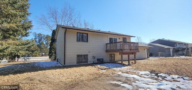 rear view of property featuring central AC