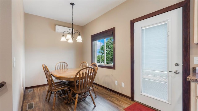 dining area featuring visible vents, baseboards, an inviting chandelier, and wood finished floors