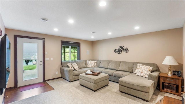 living room with recessed lighting and baseboards