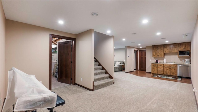 interior space featuring carpet flooring, recessed lighting, and baseboards