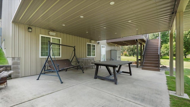 view of patio featuring stairway