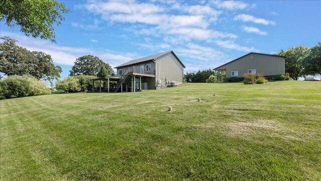 view of yard with a wooden deck