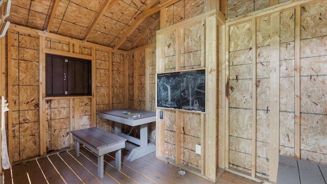 misc room featuring vaulted ceiling and wood finished floors