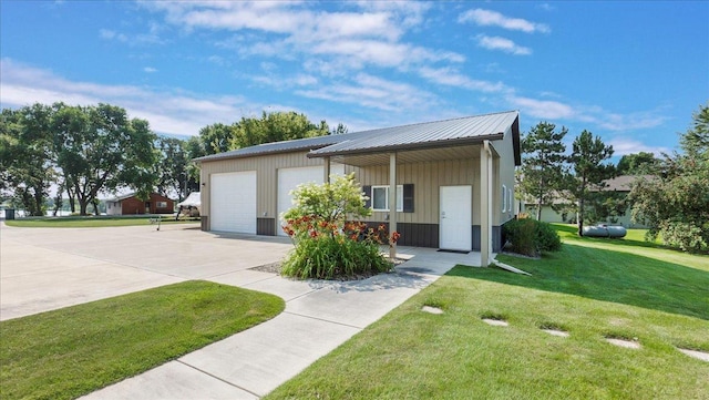 41032 Sauk Lake Rd, Sauk Centre, MN 56378 - ranch-style home with a detached garage, board and batten siding, a front yard, and metal roof