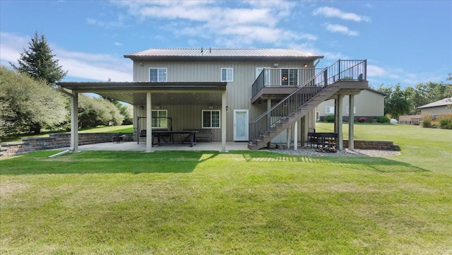 41032 Sauk Lake Rd, Sauk Centre, MN 56378 - back of property featuring stairs, a deck, a lawn, a patio, and metal roof