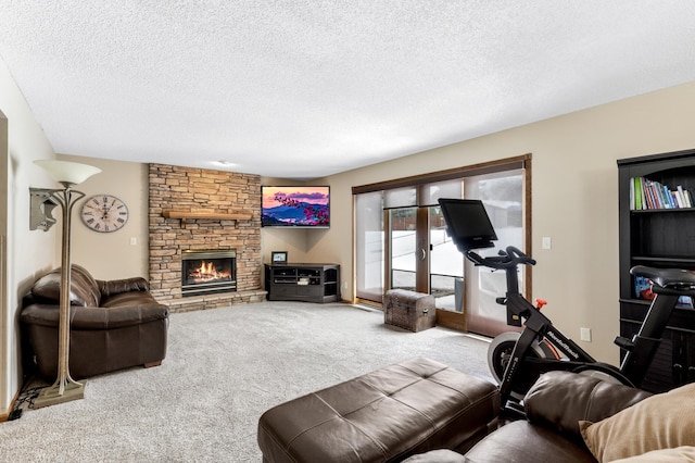 carpeted living room featuring a textured ceiling and a stone fireplace