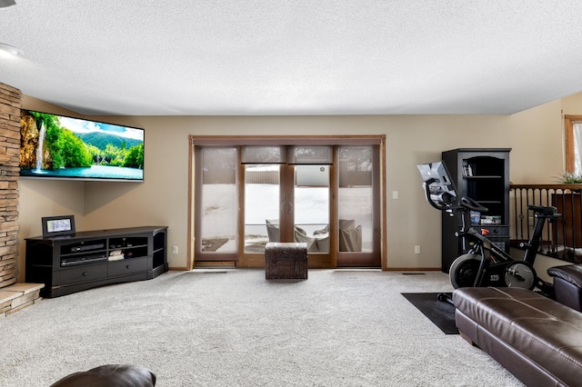 living area featuring a textured ceiling, french doors, carpet, and baseboards