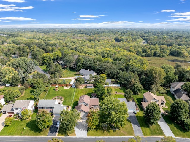 bird's eye view featuring a residential view and a view of trees