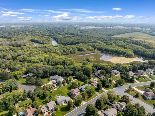 aerial view featuring a residential view, a water view, and a forest view