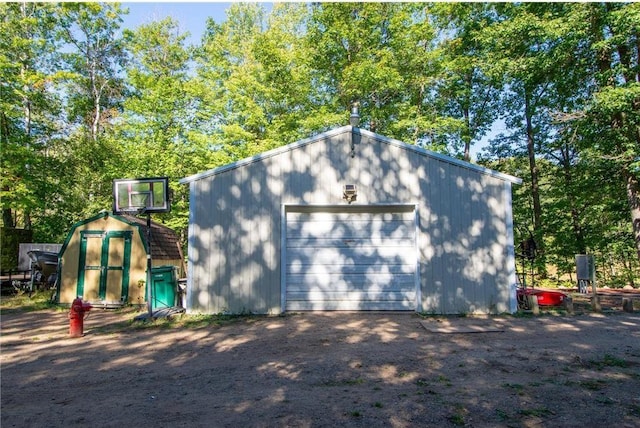 detached garage featuring driveway