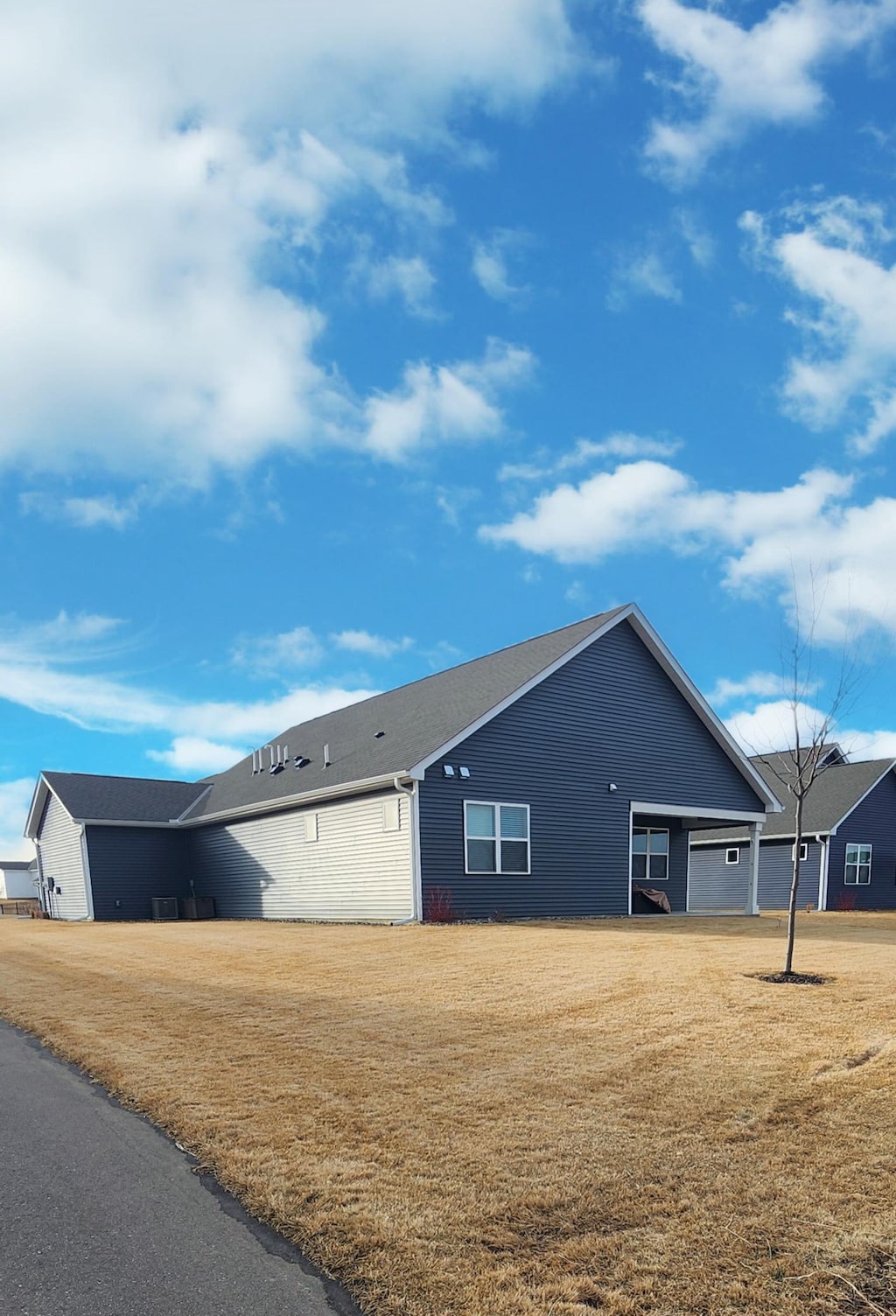 view of home's exterior with a yard