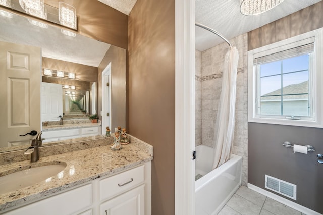 full bath featuring vanity, baseboards, visible vents, shower / bath combo with shower curtain, and tile patterned floors