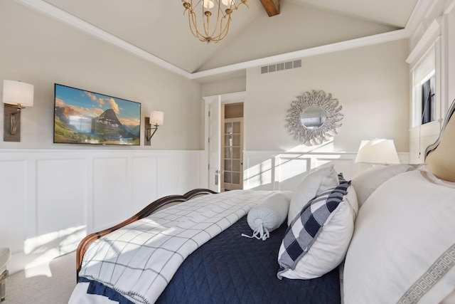 carpeted bedroom featuring visible vents, a notable chandelier, a wainscoted wall, and vaulted ceiling with beams