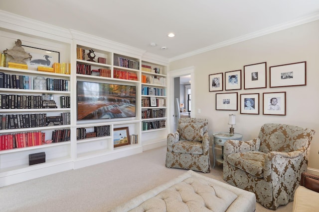 sitting room with built in features, carpet, and ornamental molding