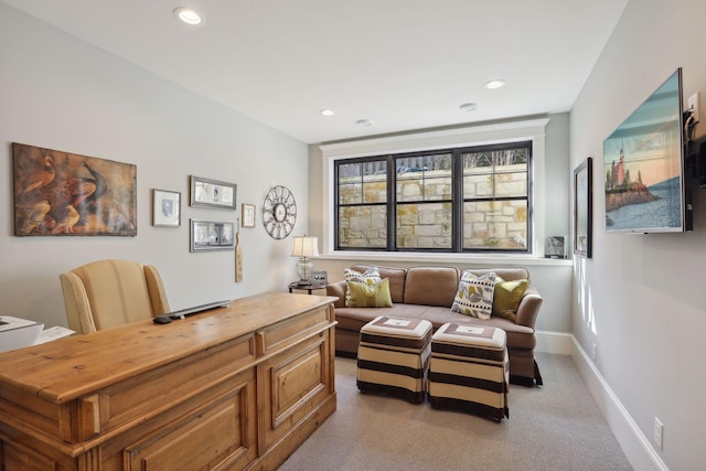 office space featuring recessed lighting, light colored carpet, and baseboards