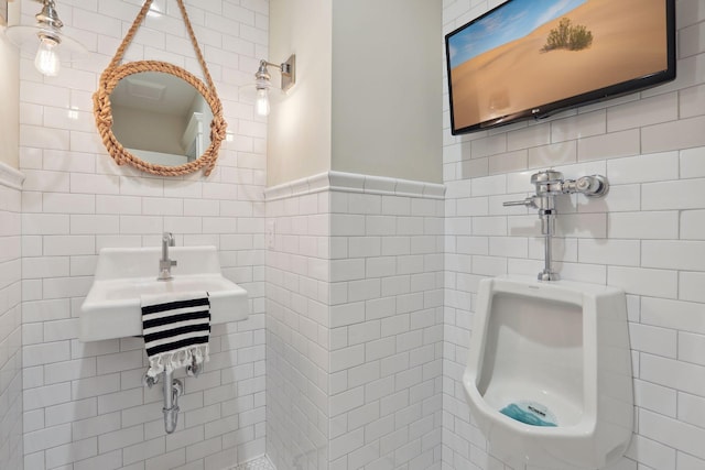 bathroom with tile walls