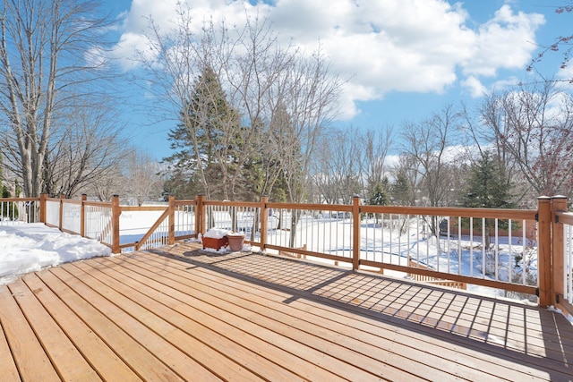 view of snow covered deck