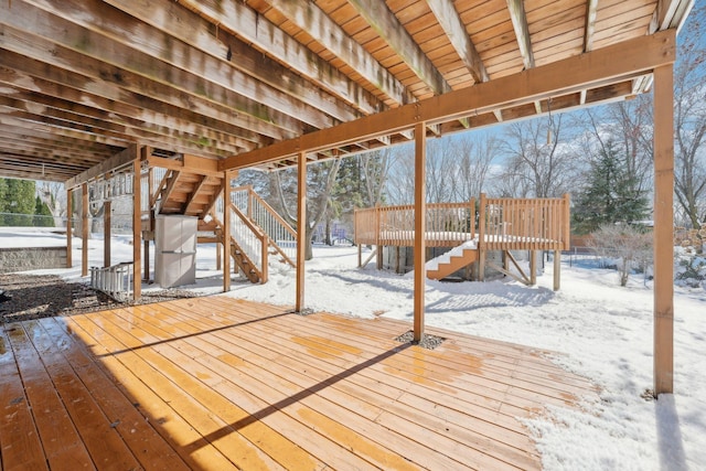 snow covered deck with stairway