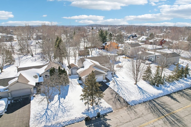 snowy aerial view featuring a residential view