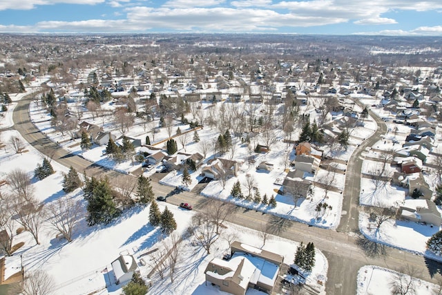 snowy aerial view featuring a residential view