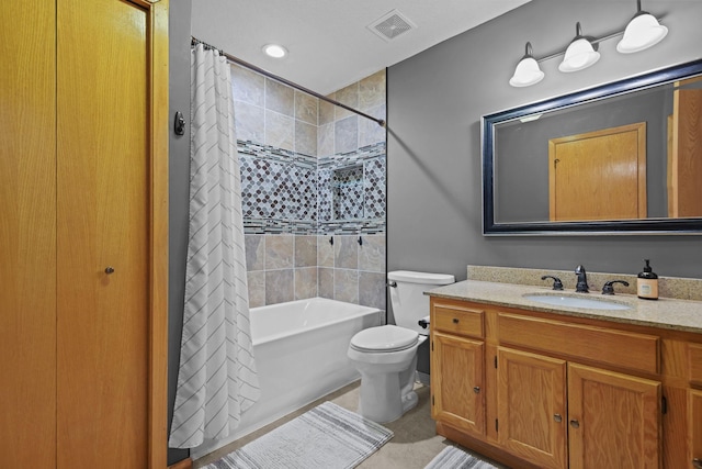 full bathroom with visible vents, toilet, shower / tub combo with curtain, tile patterned floors, and vanity