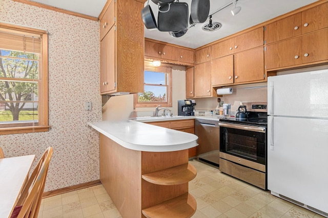 1938 Sheridan Ave, Saint Paul, MN 55116 - kitchen featuring stainless steel appliances, open shelves, a peninsula, a sink, and light countertops