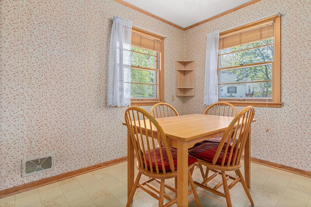 1938 Sheridan Ave, Saint Paul, MN 55116 - dining room with crown molding, light flooring, wallpapered walls, and baseboards