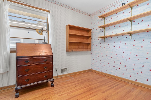 1938 Sheridan Ave, Saint Paul, MN 55116 - bedroom featuring wallpapered walls, light wood-style floors, and baseboards