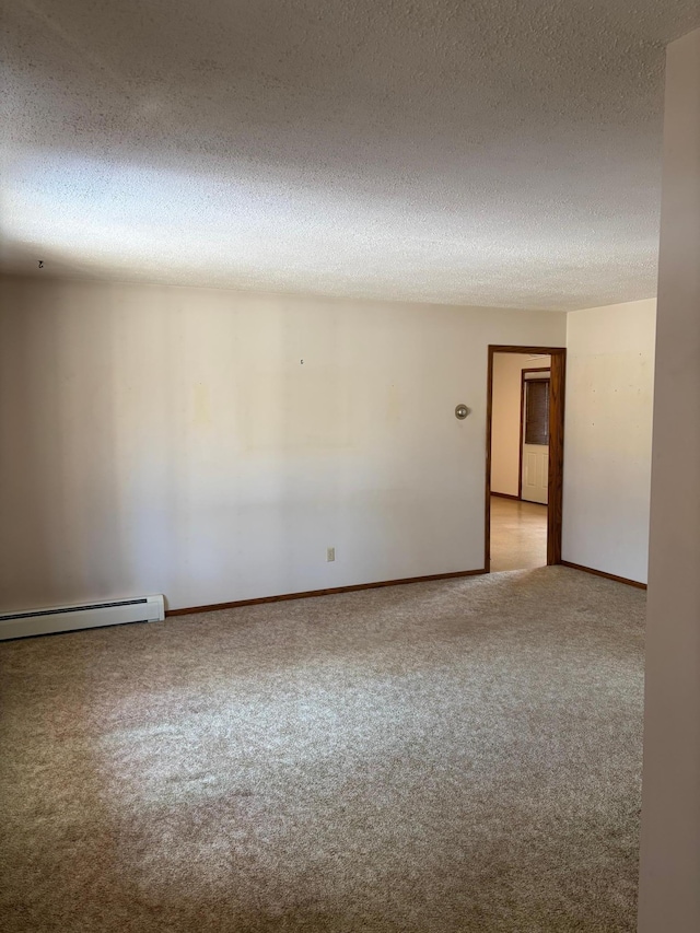 unfurnished room featuring a baseboard radiator, baseboards, a textured ceiling, and carpet flooring