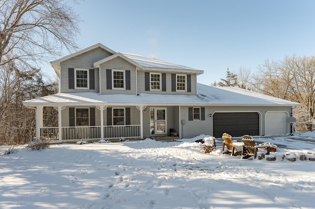 view of front of home featuring covered porch and an attached garage